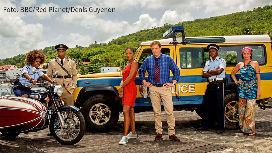 Die Karibik-Krimiserie „Death in Paradise“ geht am 28. August bei Fox in eine neue Staffel. Darin nimmt Ardal O'Hanlon als Detective Inspector Jack Mooney Abschied vom Inselparadies. (Foto: BBC/Red Planet/Denis Guyenon)